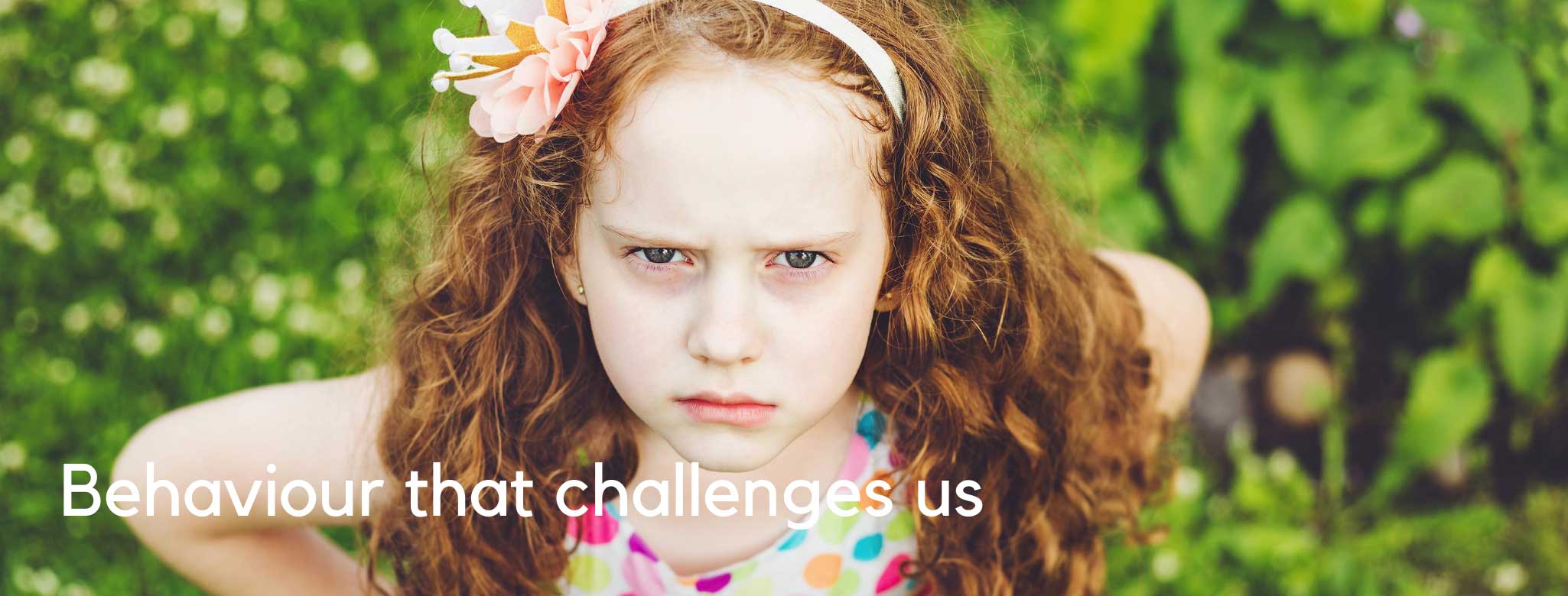 young red haired girl with a stern look on her face