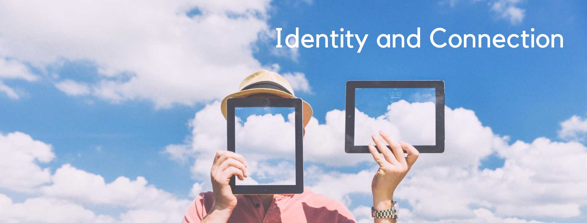 man standing behind two frames